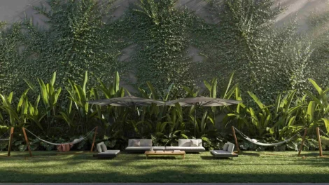 Área externa com jardim e mobiliário integrado à natureza, representando arquitetura biofílica residencial.